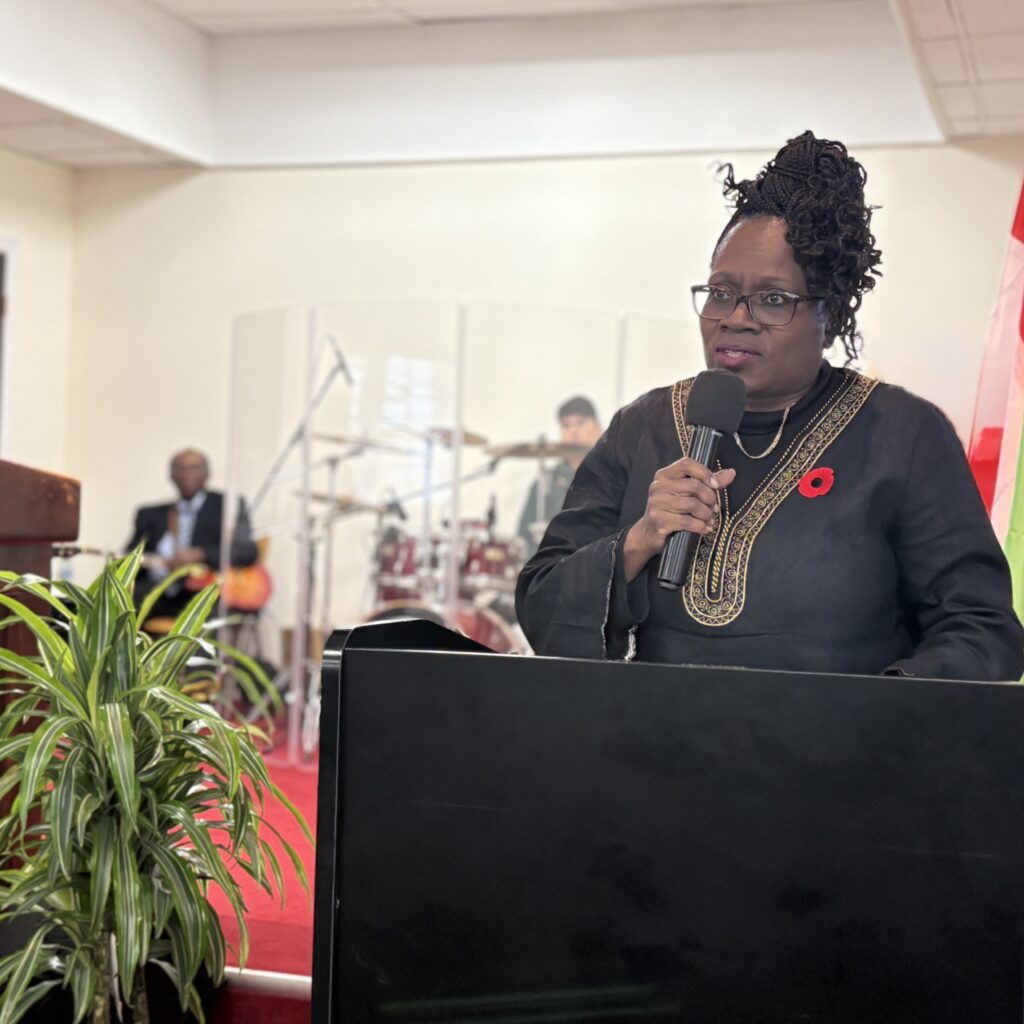 Sarah Onyango Presenting a United Way East Ontario Community Builder Award to Pastor Carmen Hamilton